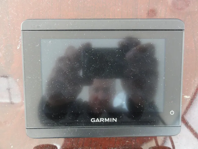 Slide: The Image of Garmin GPS device on a 2009 Meridian 441 Sedan boat dashboard. - 19