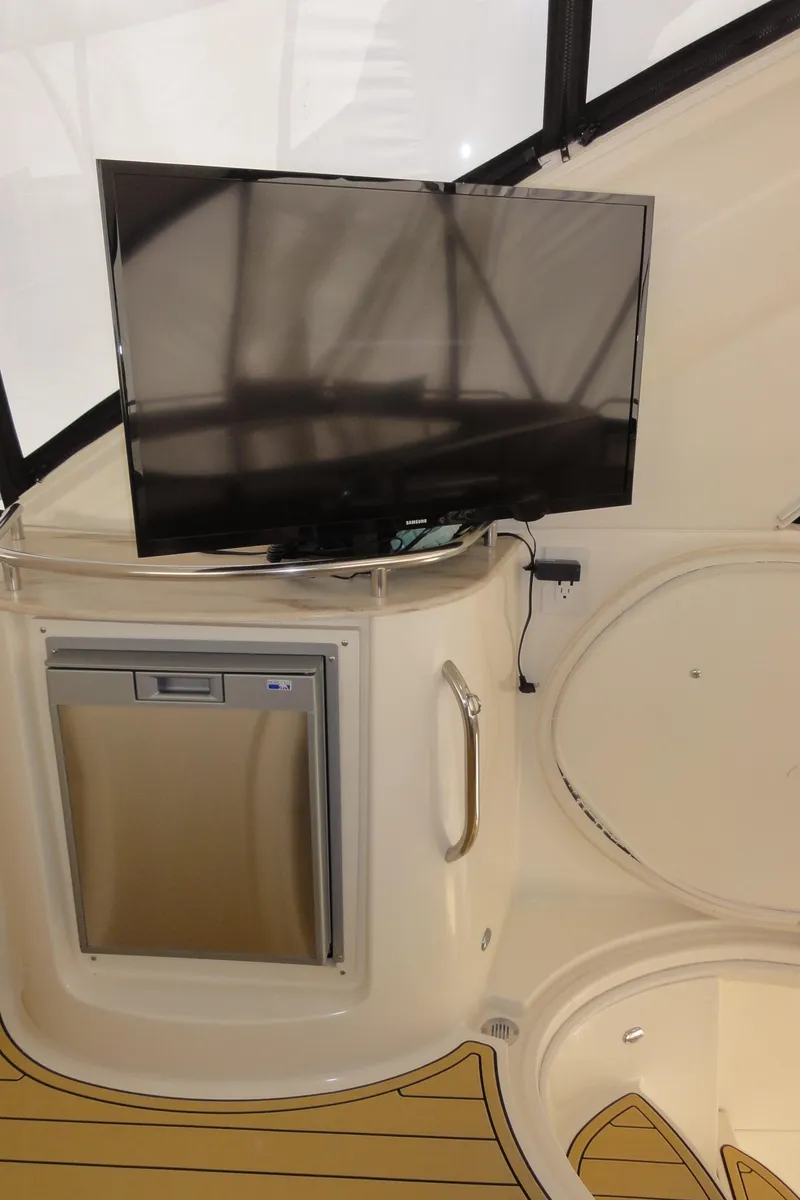 Slide: The Image of Interior of 2009 Meridian 441 Sedan with mounted TV and mini fridge. - 25