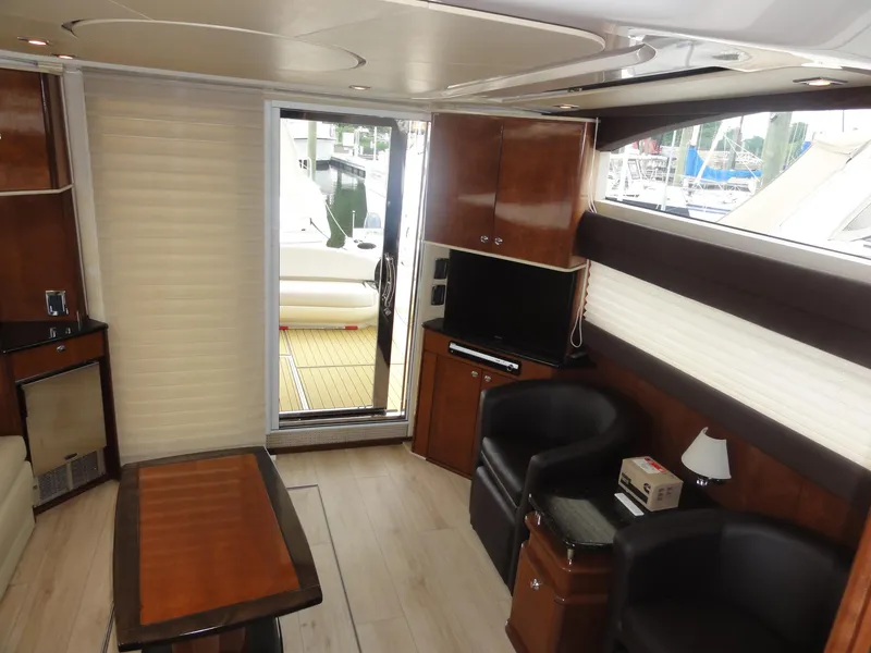 Slide: The Image of Luxurious interior of 2009 Meridian 441 Sedan yacht with modern furnishings and wood accents. - 32