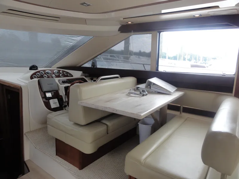 Slide: The Image of Interior of 2009 Meridian 441 Sedan yacht with helm and seating area. - 37
