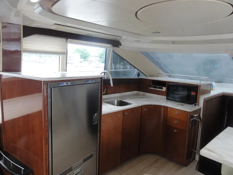 Slide: The Image of Luxurious kitchen interior of 2009 Meridian 441 Sedan yacht with modern appliances. - 38