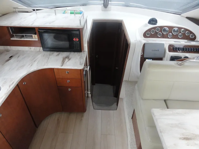 Slide: The Image of 2009 Meridian 441 Sedan interior with kitchen, microwave, and control panel. - 41
