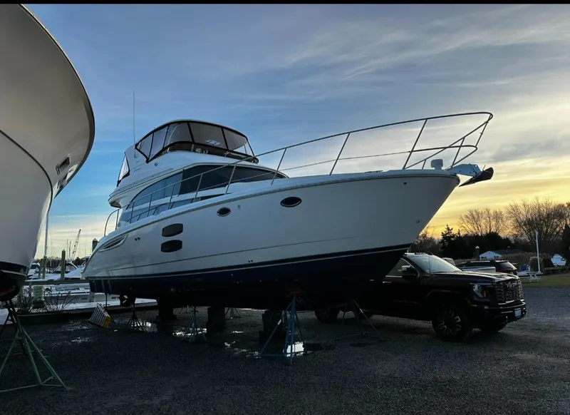 Slide: The Image of 2009 Meridian 441 Sedan yacht on stands at sunset, side view. - 8