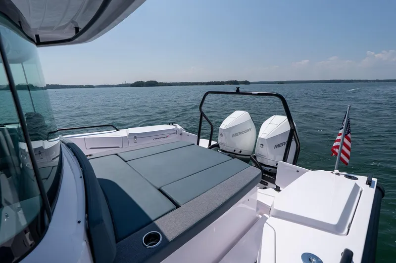 Slide: The Image of Axopar 37 Aft Cabin 2026 cruising on open water, rear view. - 10