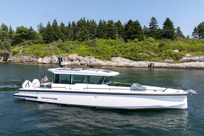 Slide: The Image of Axopar 37 Aft Cabin 2026 cruising on open water. - 3