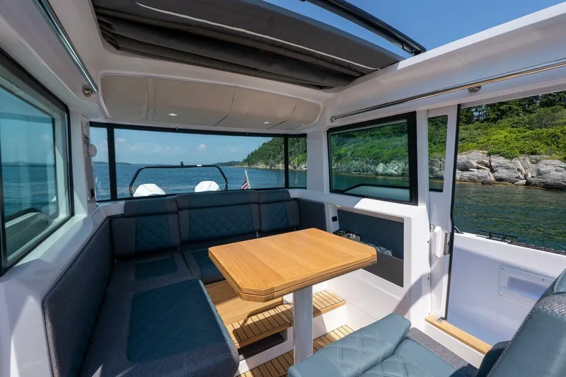 Slide: The Image of Interior view of Axopar 37 Aft Cabin 2026 on the water. - 39