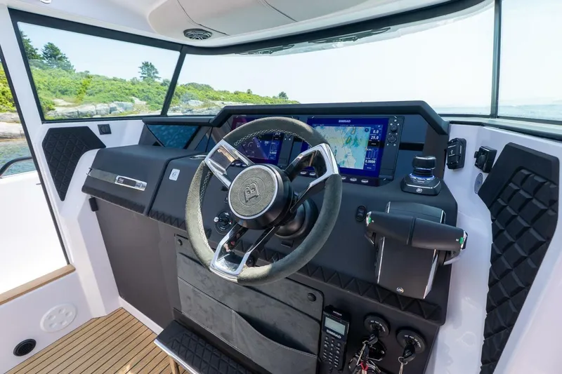 Slide: The Image of Axopar 37 Aft Cabin 2026 dashboard with Simrad displays. - 45