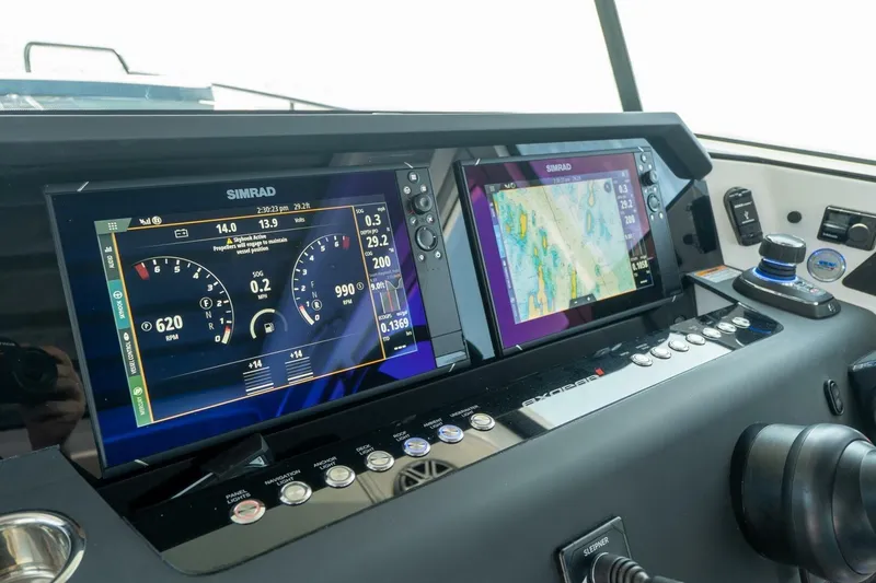 Slide: The Image of Axopar 37 Aft Cabin 2026 dashboard with Simrad displays. - 46