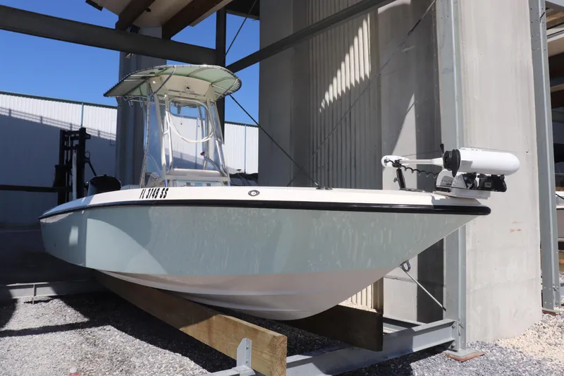 The Image of 2013 Young Boats 24 model in storage, featuring a sleek design and modern equipment. - 1
