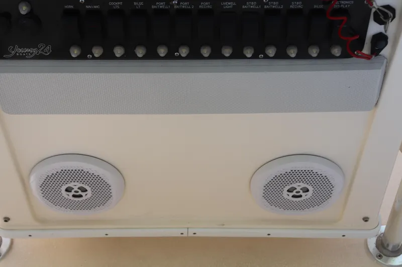 Slide: The Image of Control panel and speakers on a 2013 Young Boats 24 model. - 24
