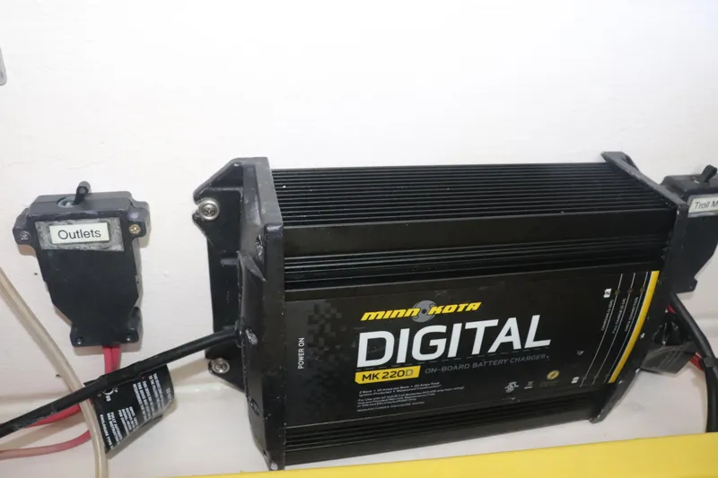 Slide: The Image of Minn Kota MK 2200 digital battery charger on 2013 Young Boats 24. - 25