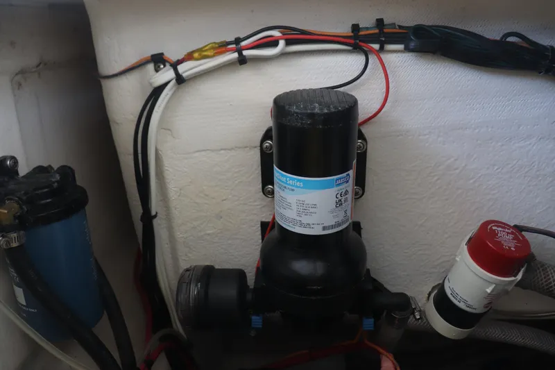 Slide: The Image of 2013 Young Boats 24 model with Jabsco pump and wiring setup. - 31