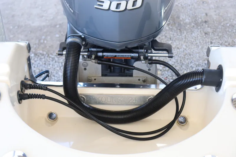Slide: The Image of 2013 Young Boats 24 with powerful 300 horsepower outboard motor, detailed view. - 32