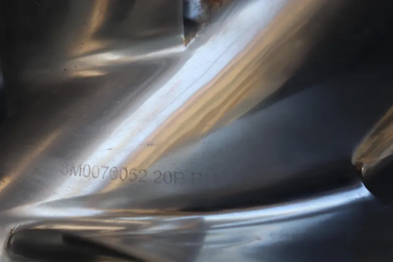 Slide: The Image of Close-up of a metallic surface with engraved serial number, Young Boats 24, 2013 model. - 35