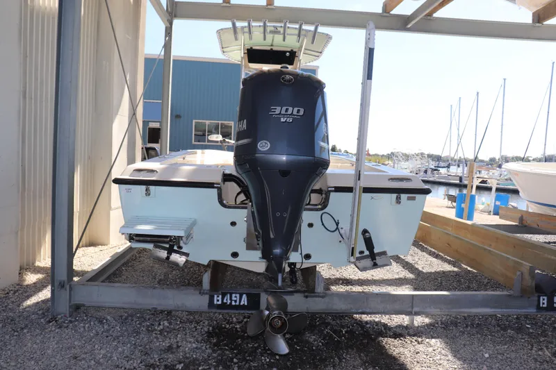 Slide: The Image of 2013 Young Boats 24 with Yamaha 300 V6 engine on trailer. - 4