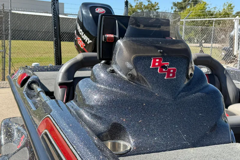 Slide: The Image of 2017 Bass Cat Eyra boat with Mercury engine, featuring sleek design and metallic finish. - 10