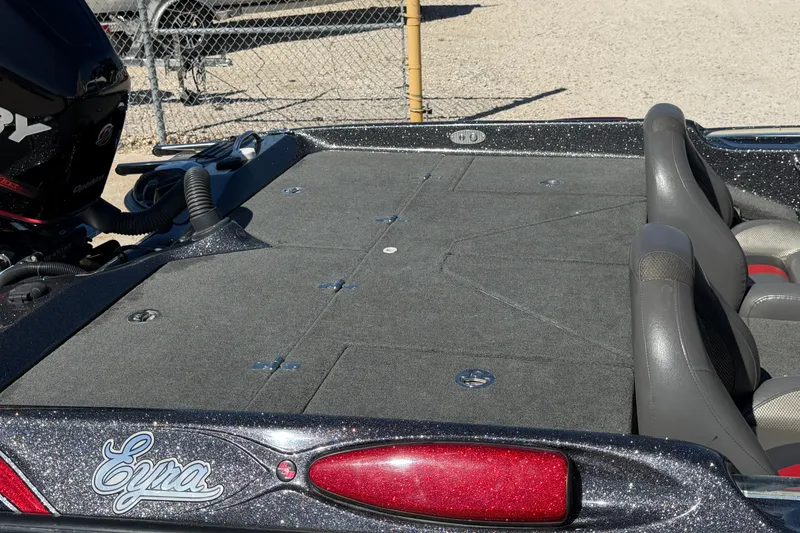 Slide: The Image of 2017 Bass Cat Eyra boat deck with Mercury engine, featuring spacious seating and storage. - 13