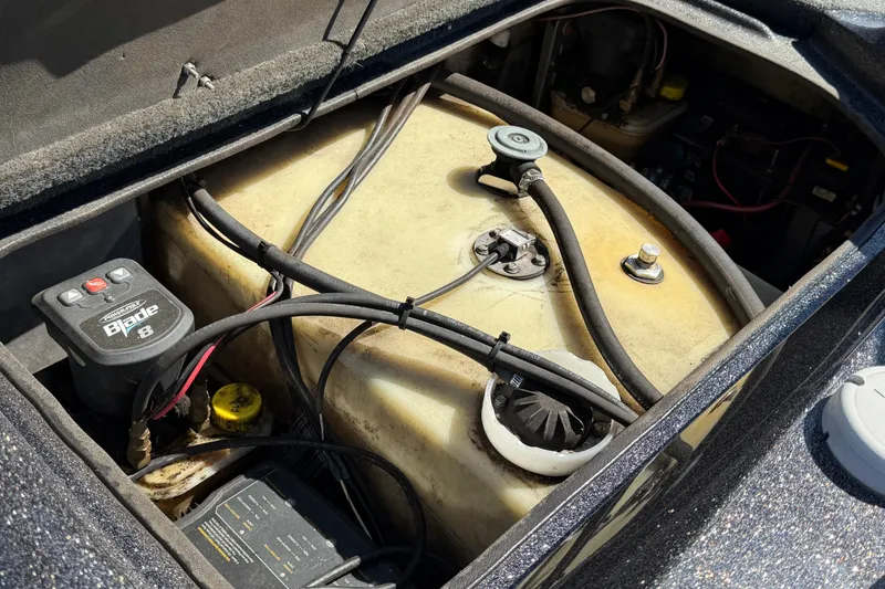 Slide: The Image of 2017 Bass Cat Eyra boat fuel tank and wiring components. - 17