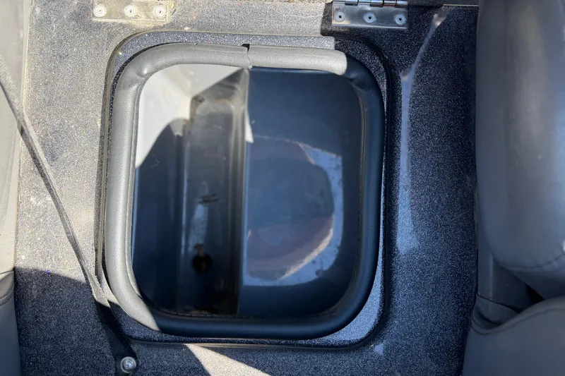 Slide: The Image of Open storage compartment in a 2017 Bass Cat Eyra boat. - 22