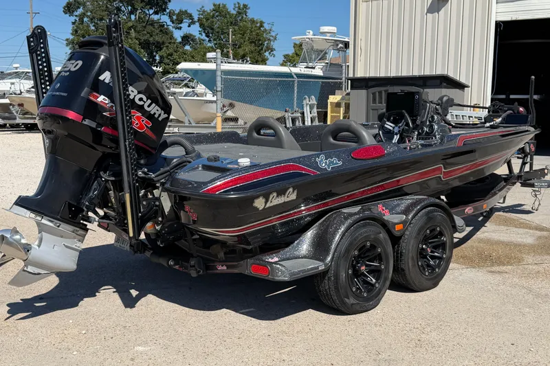 Slide: The Image of 2017 Bass Cat Eyra boat with Mercury Pro XS engine, parked outdoors. - 4