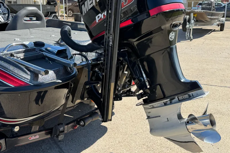 Slide: The Image of 2017 Bass Cat Eyra boat with Mercury Pro XS outboard motor, parked on concrete. - 6