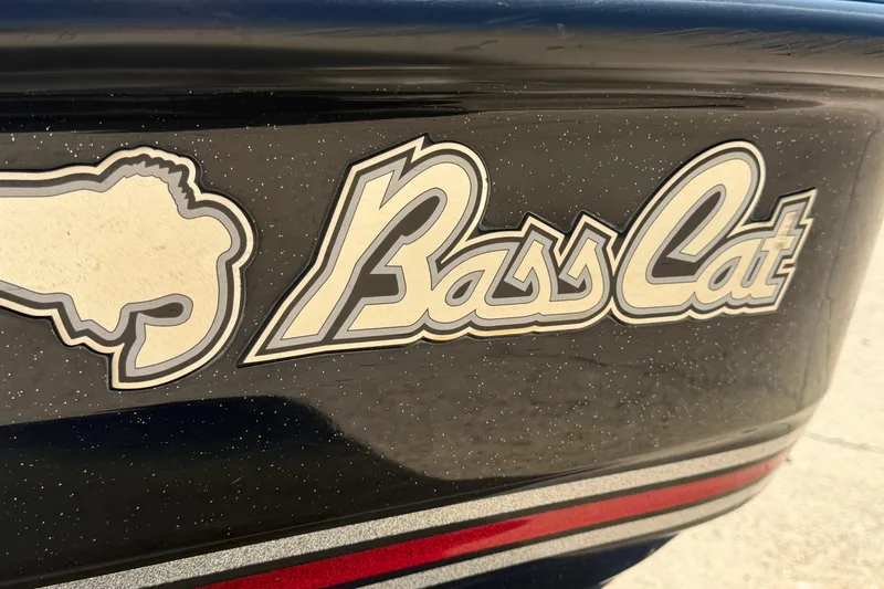 Slide: The Image of 2017 Bass Cat Eyra logo on a sleek, black boat surface. - 8