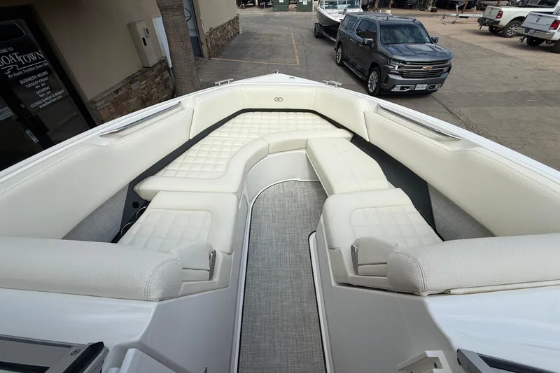 Slide: The Image of 2020 Cobalt R5 Surf boat with luxurious white seating and spacious interior. - 12