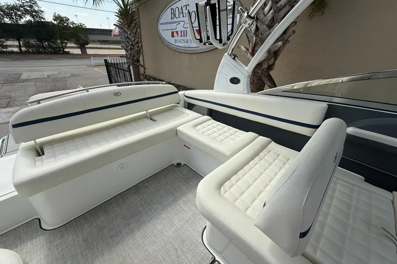 Slide: The Image of 2020 Cobalt R5 Surf boat interior with white cushioned seating and sleek design. - 14