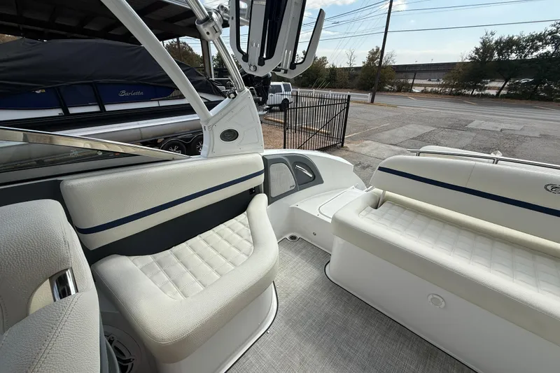 Slide: The Image of 2020 Cobalt R5 Surf boat interior with white cushioned seating and sleek design. - 15