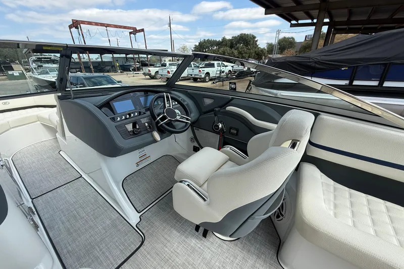Slide: The Image of 2020 Cobalt R5 Surf boat interior with modern dashboard and comfortable seating. - 9