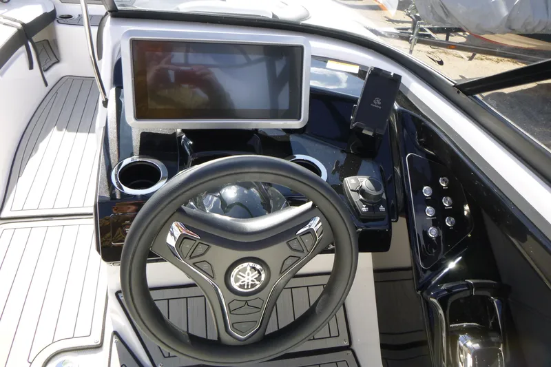 Slide: The Image of 2026 Yamaha Boats 252SD dashboard with touchscreen, steering wheel, and control panel. - 11
