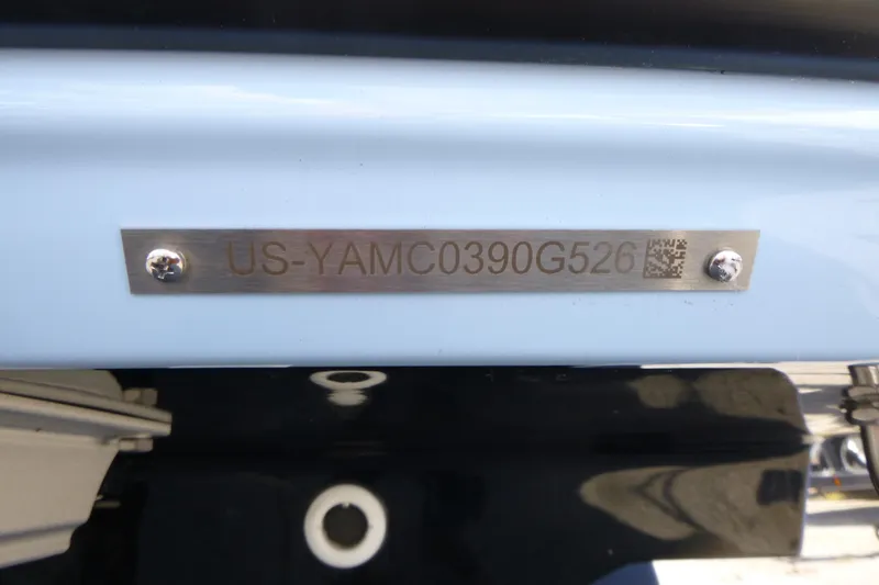 Slide: The Image of Hull identification number on 2026 Yamaha Boats 252SD, featuring metal plate with screws. - 20