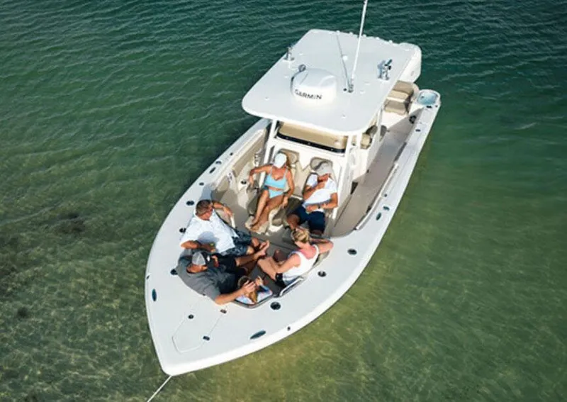 The Image of 2026 Key West 291 FS boat on trailer, parked outdoors under a cloudy sky. - 1