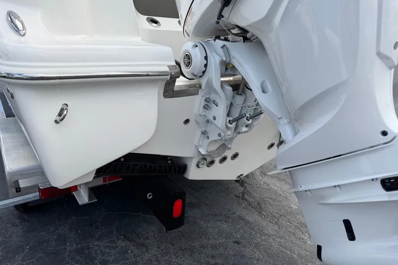 Slide: The Image of 2026 Key West 291 FS boat engine and stern detail on trailer. - 11