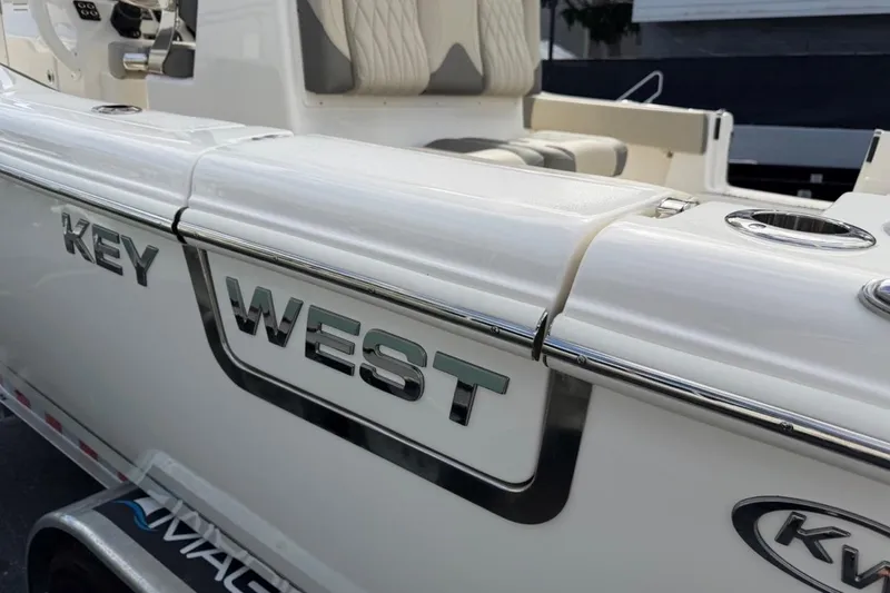 Slide: The Image of 2026 Key West 291 FS boat, sleek design with chrome accents and comfortable seating. - 9