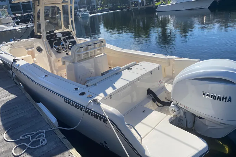Slide: The Image of 2024 Grady-White Fisherman 236 boat docked, featuring Yamaha engine, sleek design. - 1