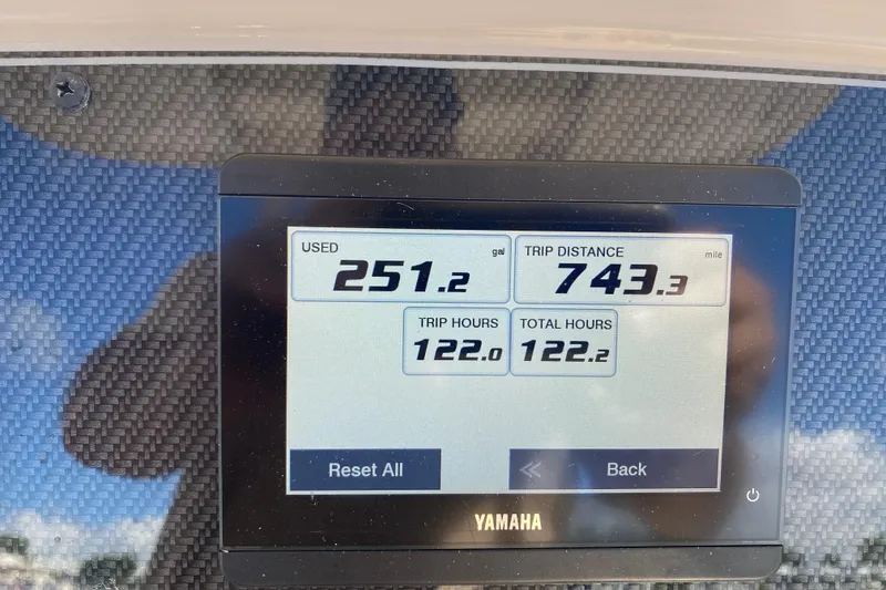 Slide: The Image of Yamaha display showing fuel usage and trip data on 2024 Grady-White Fisherman 236. - 11