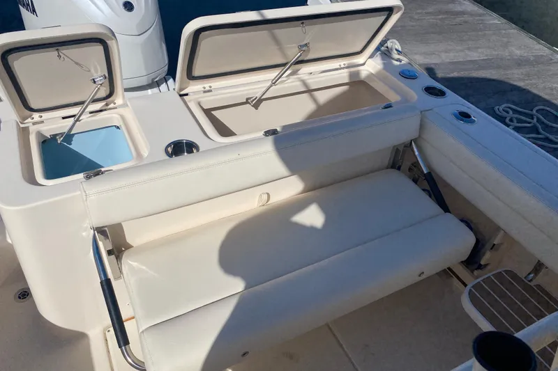 Slide: The Image of 2024 Grady-White Fisherman 236 boat interior with seating and storage compartments. - 15