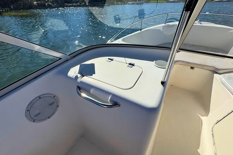 Slide: The Image of Interior view of a 2002 Sea Hunt Escape 200 boat, showing seating and storage. - 11