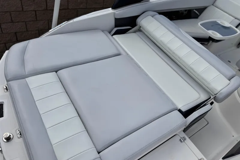 Slide: The Image of 2014 Regal 27 FasDeck boat with luxurious gray and white seating. - 10