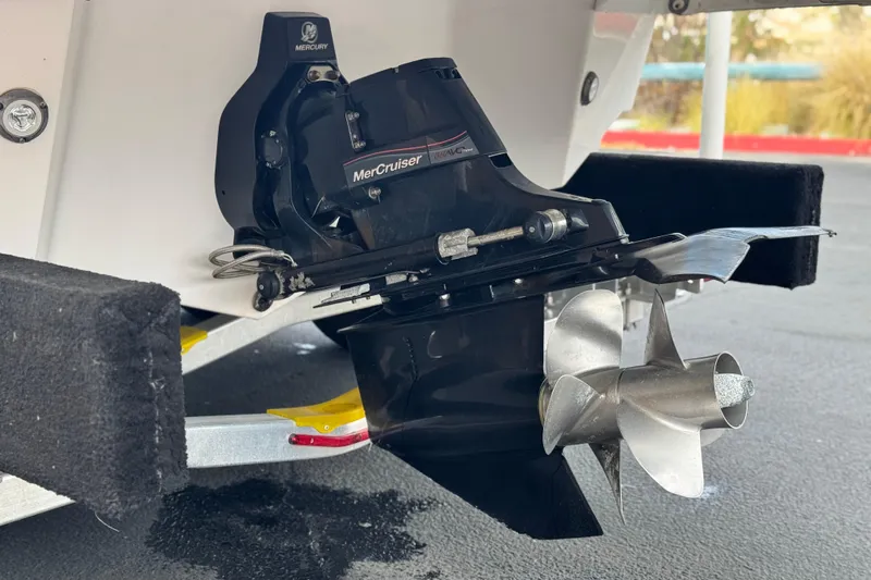 Slide: The Image of MerCruiser engine on 2014 Regal 27 FasDeck boat, featuring a stainless steel propeller. - 11