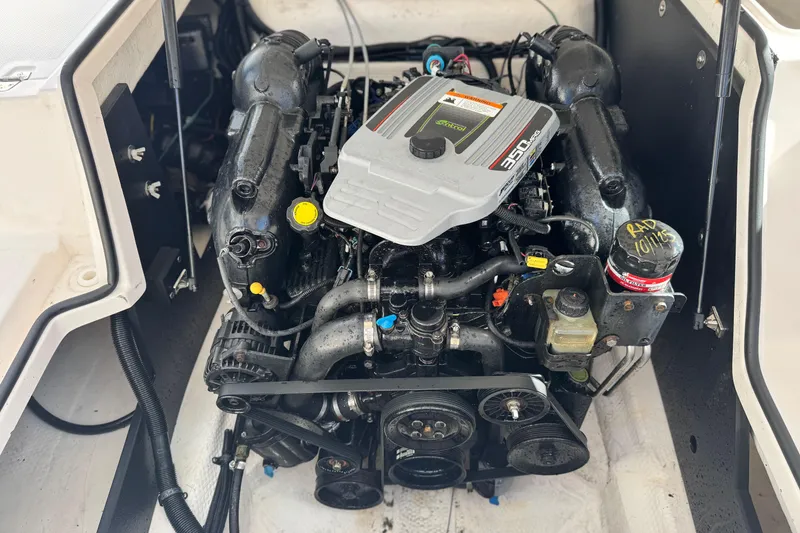 Slide: The Image of Engine compartment of a 2014 Regal 27 FasDeck boat, featuring a 350 horsepower engine. - 22