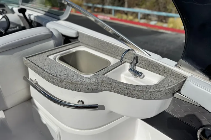 Slide: The Image of 2014 Regal 27 FasDeck boat interior with sink and countertop. - 24
