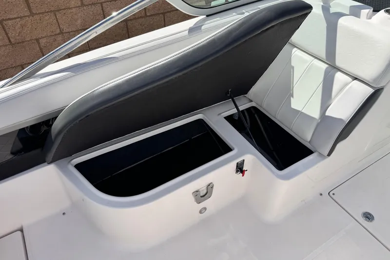 Slide: The Image of 2014 Regal 27 FasDeck boat interior with open storage compartments. - 26