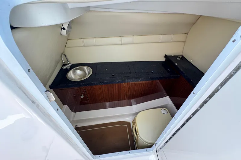 Slide: The Image of 2014 Regal 27 FasDeck boat interior with sink and toilet. - 27