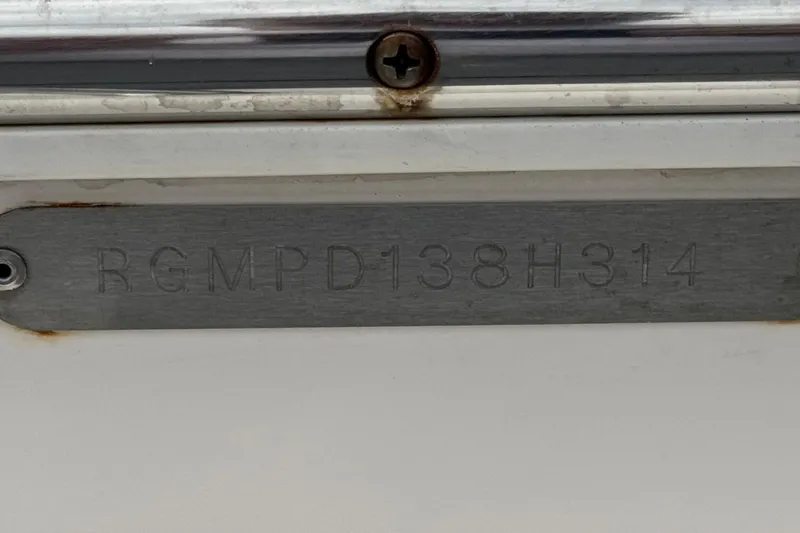 Slide: The Image of 2014 Regal 27 FasDeck boat identification plate with serial number RGMPD138H314. - 34