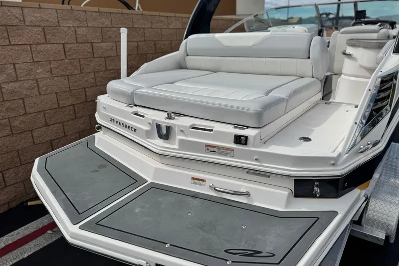 Slide: The Image of 2014 Regal 27 FasDeck boat with white seating and swim platform. - 6