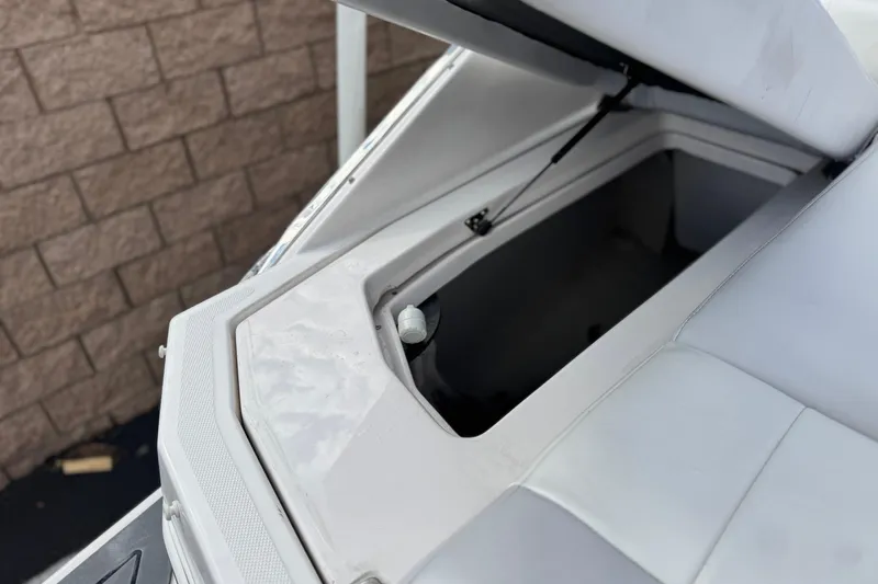 Slide: The Image of Open storage compartment on a 2014 Regal 27 FasDeck boat, showcasing interior space. - 7