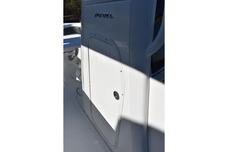 Slide: The Image of 2025 NauticStar 242L Offshore boat detail with storage compartment. - 40