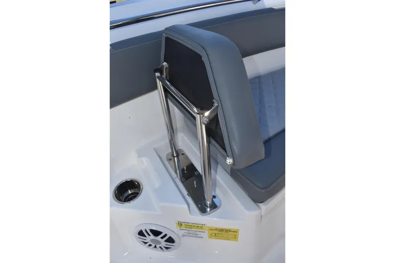 Slide: The Image of 2025 NauticStar 242L Offshore boat seat with stainless steel frame and cup holder. - 43